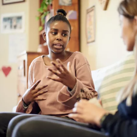 Teenage girl talking to Youth Support Coordinator