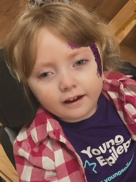 Daisie shown in a Young Epilepsy t-shirt showing support for the Purple Day campaign 2024.