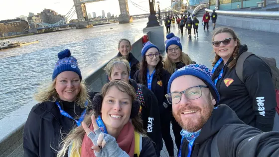 Group of walkers in hats with London Bridge in the Background