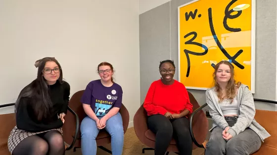 4 girls sat smiling