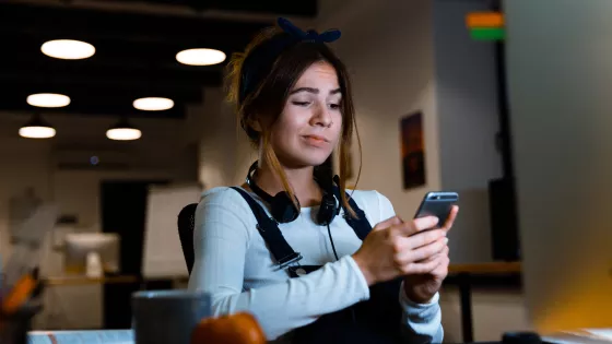 Young girl looking confused on her phone