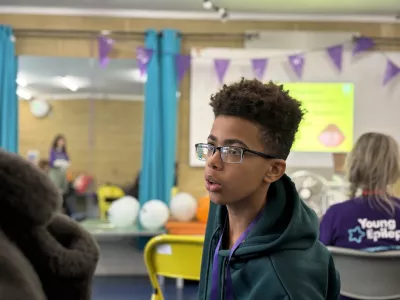 A young boy looking away from the camera