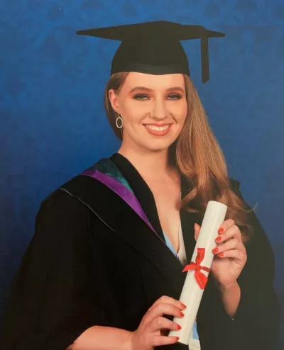 young girl in a graduation outfit