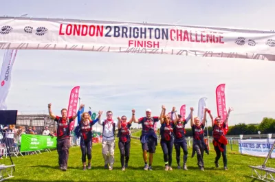 A group of people crossing the London 2 Brighton finish line