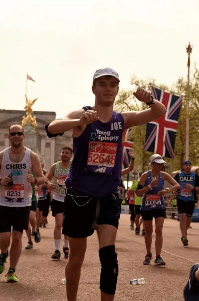 young man running a marathon