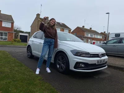 Young woman and her car