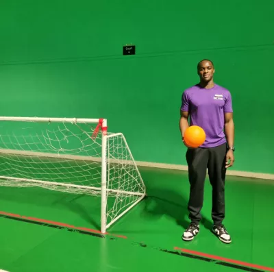 young man playing football