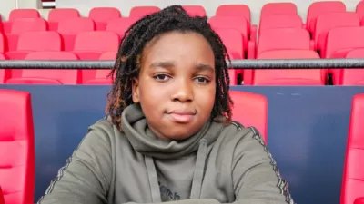 Young boy at a football stand