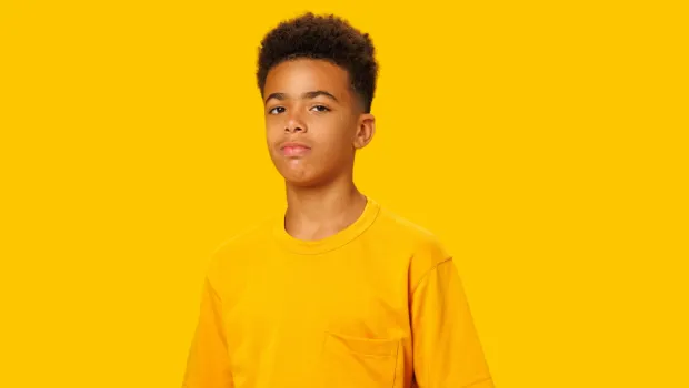 Ruben against a yellow backgruond