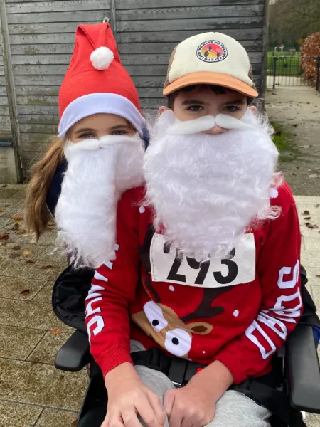 Mother and son in santa costumes