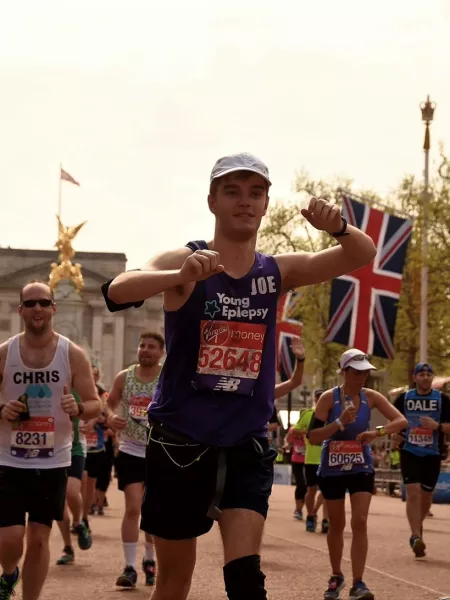 young man running a marathon